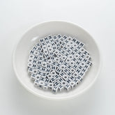 BD00119-01-black-letter-white-opaque-cube-alphabet-beads-single-h-7mm